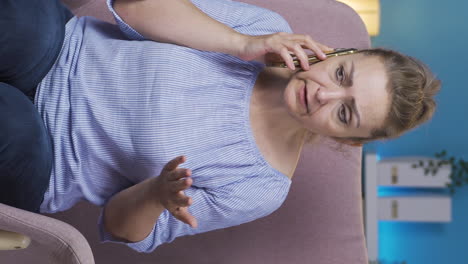 Vertical-video-of-Woman-talking-on-the-phone-arguing.